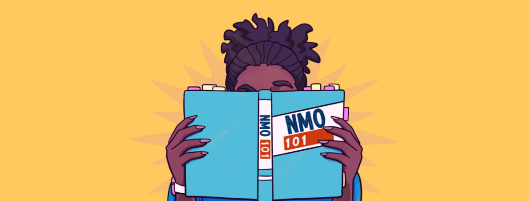 An adult woman with her face obscured by a book about the basics of NMO.